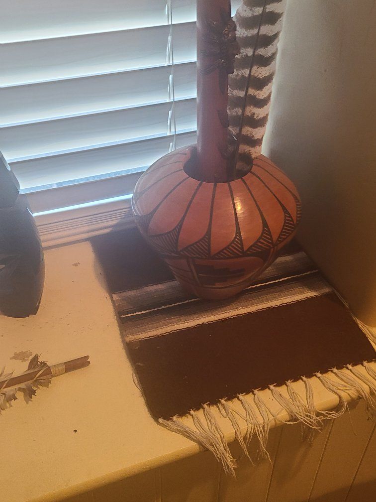 Southwestern Style Terracotta Pottery Vase with Feathers and Woven Mat
