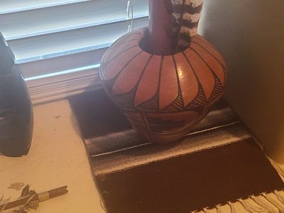 Southwestern Style Terracotta Pottery Vase with Feathers and Woven Mat