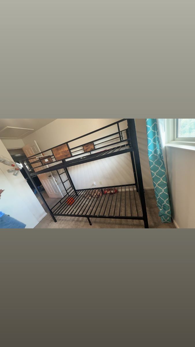 Black Metal Twin Bunk Bed Frame with Ladder - Space Saving Design. Includes 1 twin mattress. Asking $100