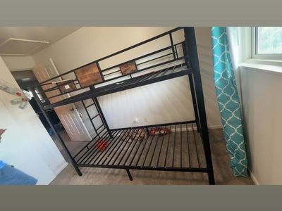 Black Metal Twin Bunk Bed Frame with Ladder - Space Saving Design. Includes 1 twin mattress. Asking $100