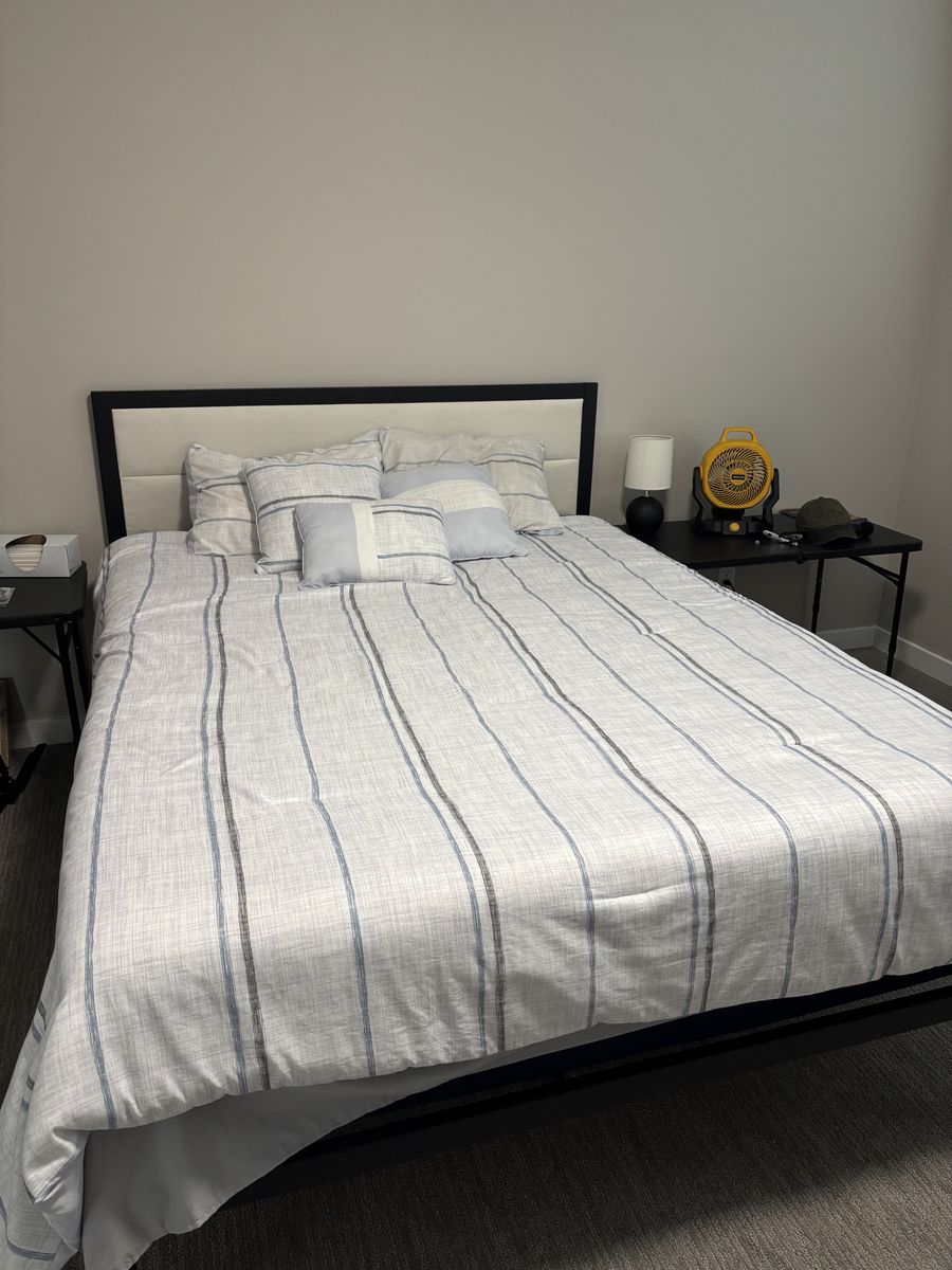 Bed frame and comforter with pillows and shams