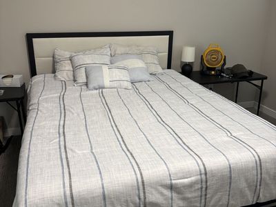 Bed frame and comforter with pillows and shams