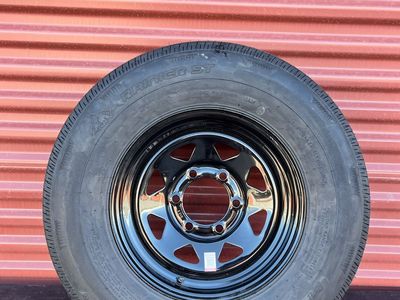 New Rainier ST 225/75 R 15 Trailer Tire Mounted on New Black Mod Wheel. 6 on 5.5 Lug Pattern Brand New