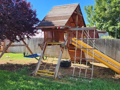 Rainbow Play Systems Wood Playset - Castle Series with Slide, Swings, and Climbing Features