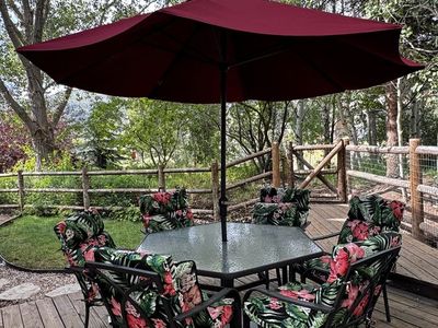Patio Dining Set with 1 glass-top table, 6 Chairs, 2 Chaise Lounges & 2 Sunbrella Umbrellas