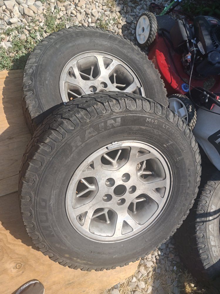LT245/75R16 All-Terrain Tires on 16" Silver Wheels -