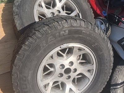 LT245/75R16 All-Terrain Tires on 16" Silver Wheels -