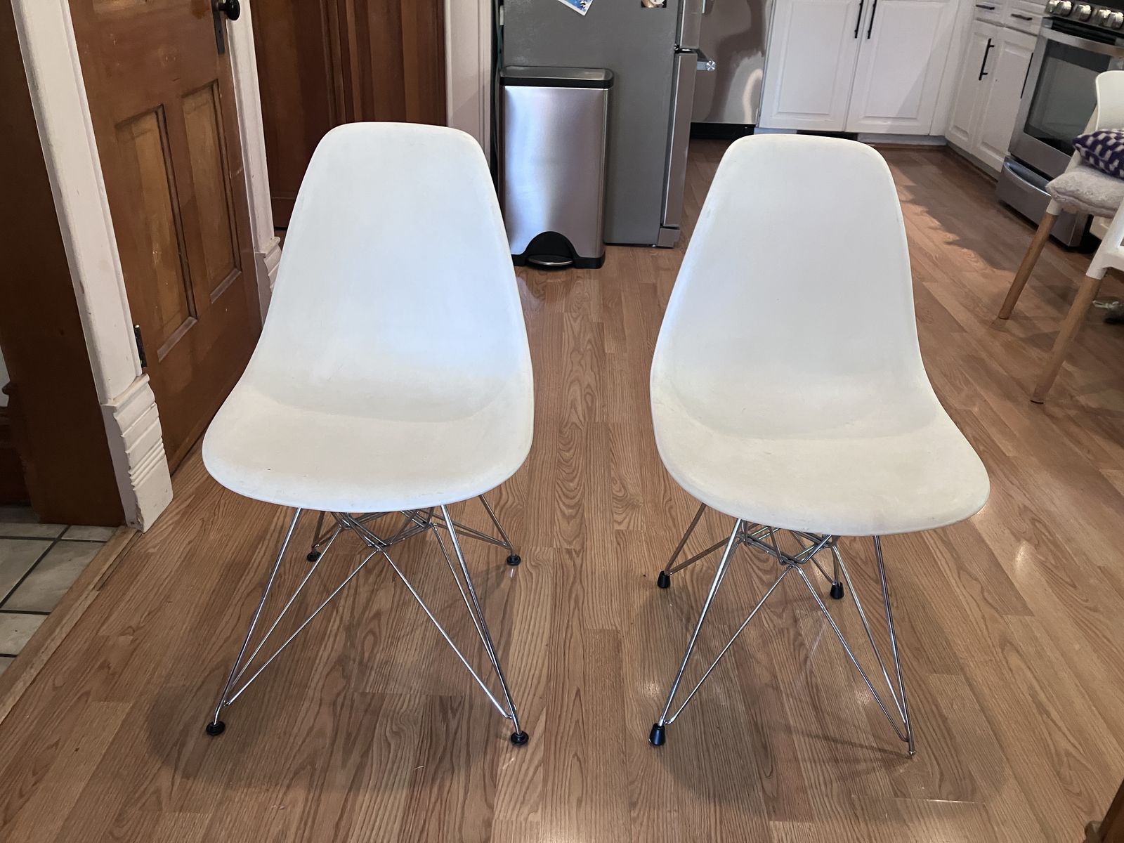 Two white plastic chairs. $20 each