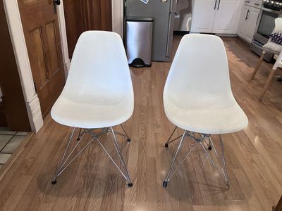 Two white plastic chairs. $20 each