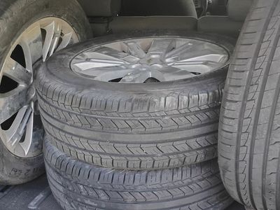 Four tires with rims and lug nuts 235 / 55 R18