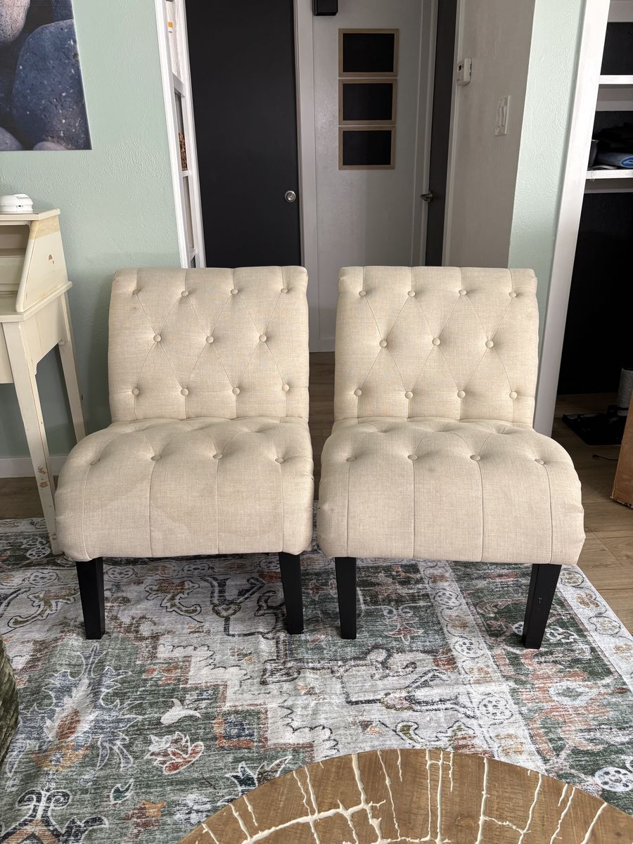 Pair of Beige Tufted Armless Accent Chairs with Dark Wood Legs