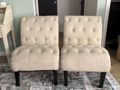 Pair of Beige Tufted Armless Accent Chairs with Dark Wood Legs