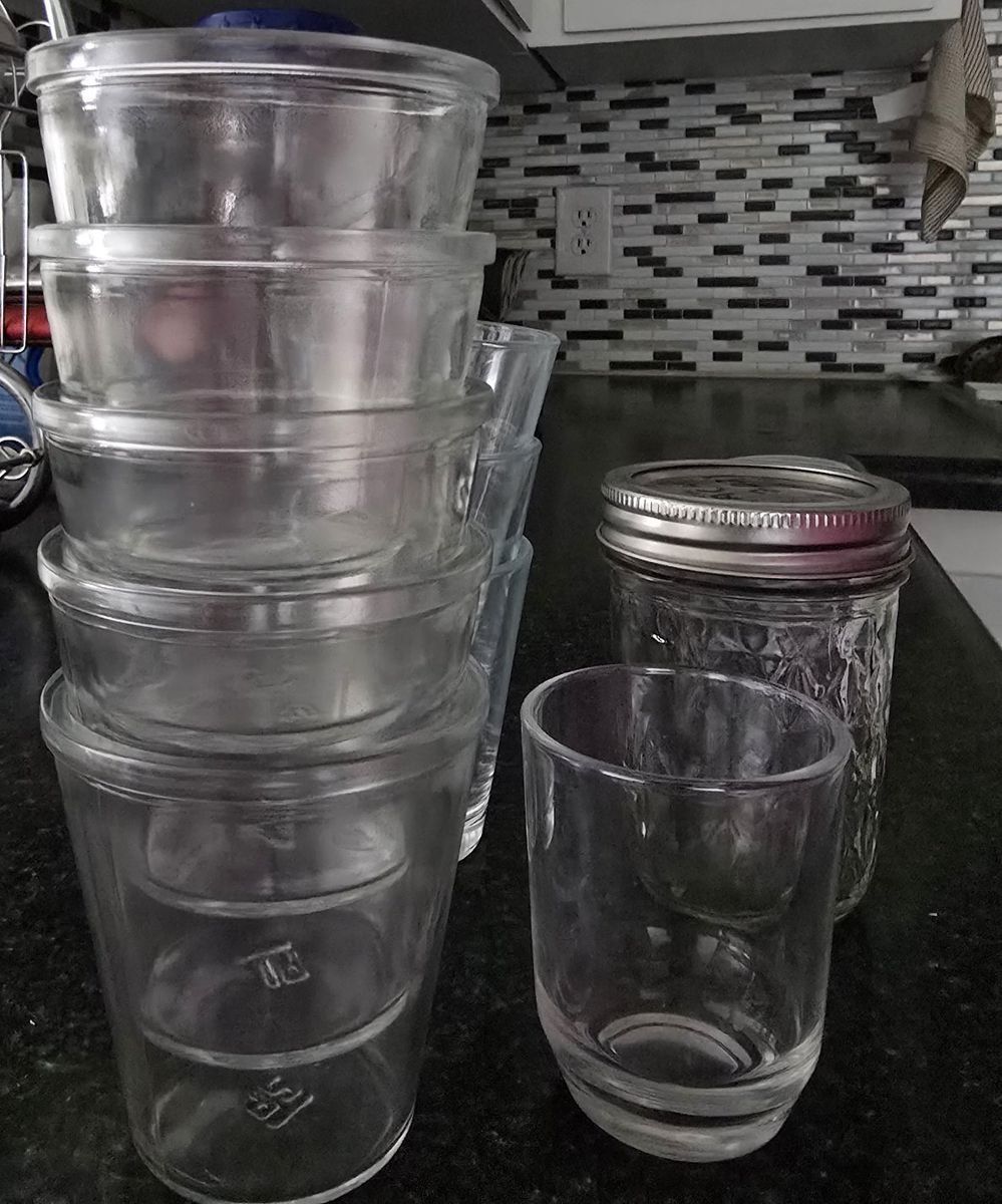 Assorted Glassware Lot Including Stackable Cups and Ball Mason Jar