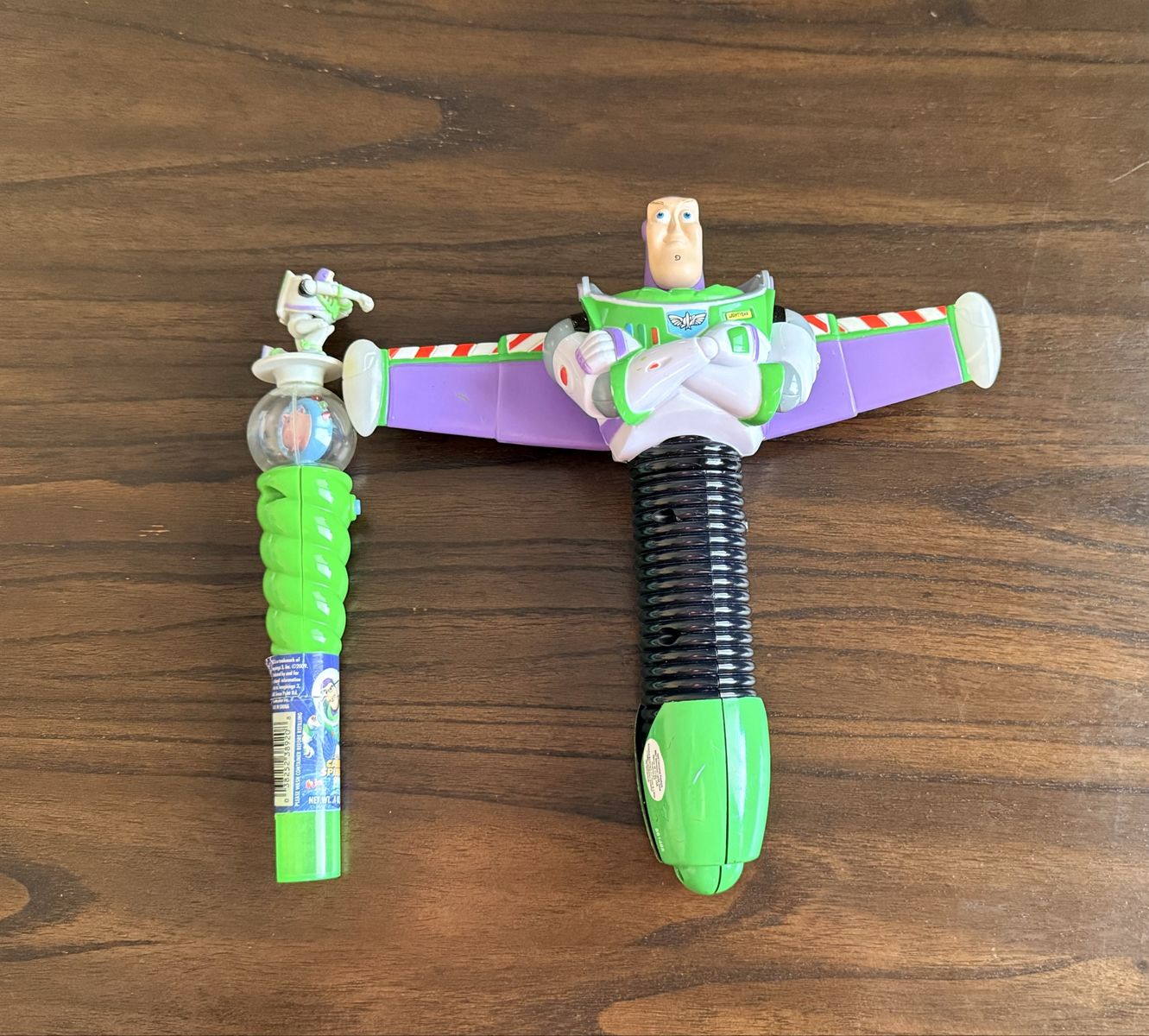 Vintage Disney Pixar Toy Story Buzz Lightyear Spinning Spaceship Toy, and a small Buzz light year Candy Wand Toy Lot