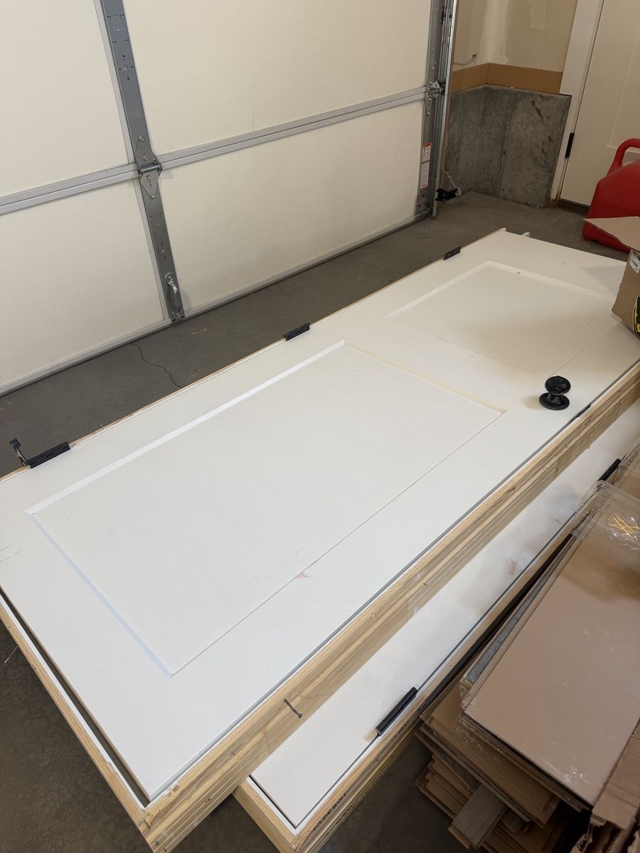 White 2-Panel Interior Door with Wooden Frame and Black Hardware - 2 Available