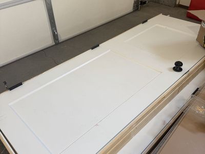 White 2-Panel Interior Door with Wooden Frame and Black Hardware - 2 Available