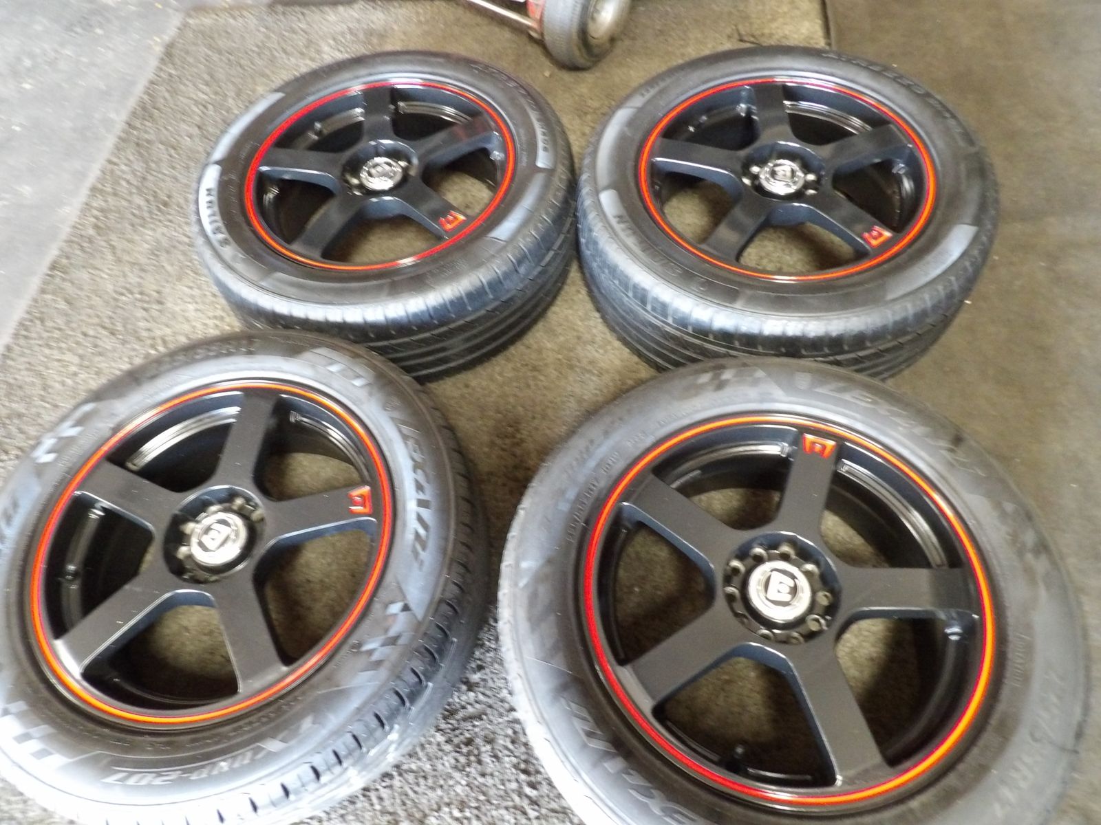 SET OF USED MONTEGI WHEELS 17X7 5X4.5 5X108 AND TIES 225/55R17
