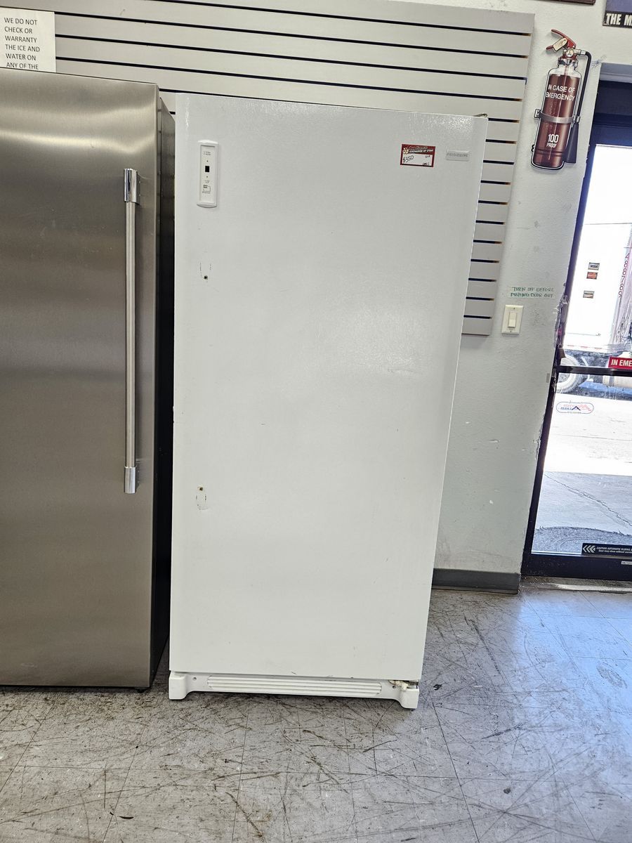 White Upright Freezer - Frigidaire Brand - Good Condition - Reliable Food Storage
