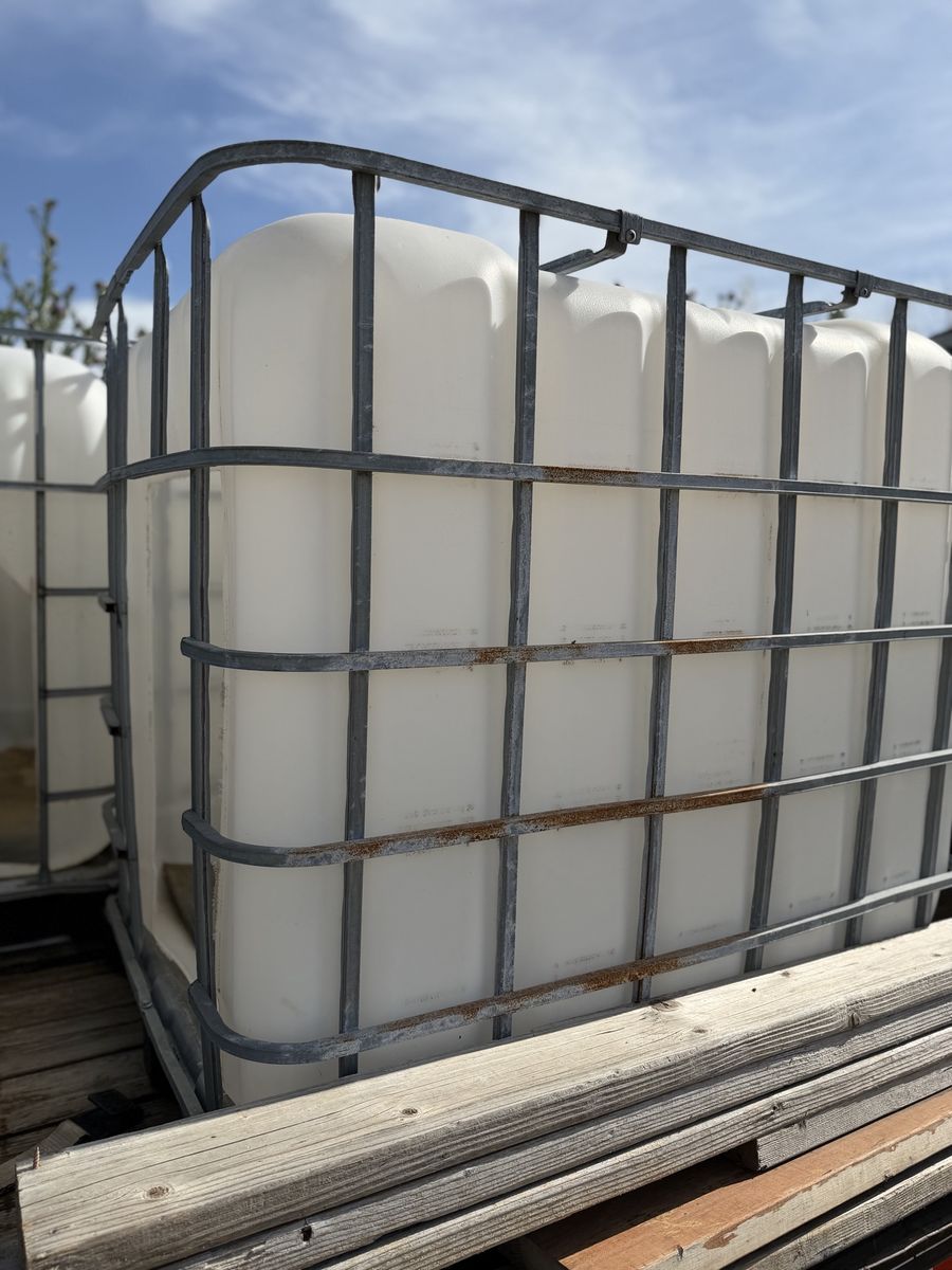 Goat houses made from  (IBC) Totes, 275 Gallon, White Plastic w/ Metal Cage,