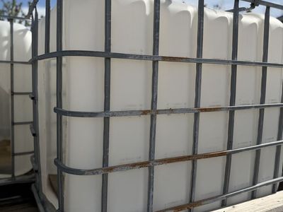 Goat houses made from (IBC) Totes, 275 Gallon, White Plastic w/ Metal Cage,