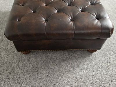 Brown Tufted Faux Leather Ottoman with Nailhead Trim