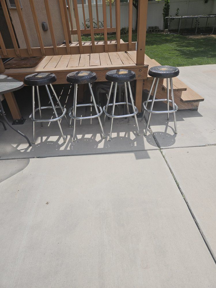 Set of 4 Chrome Bar Stools with Round Black Swivel Seats