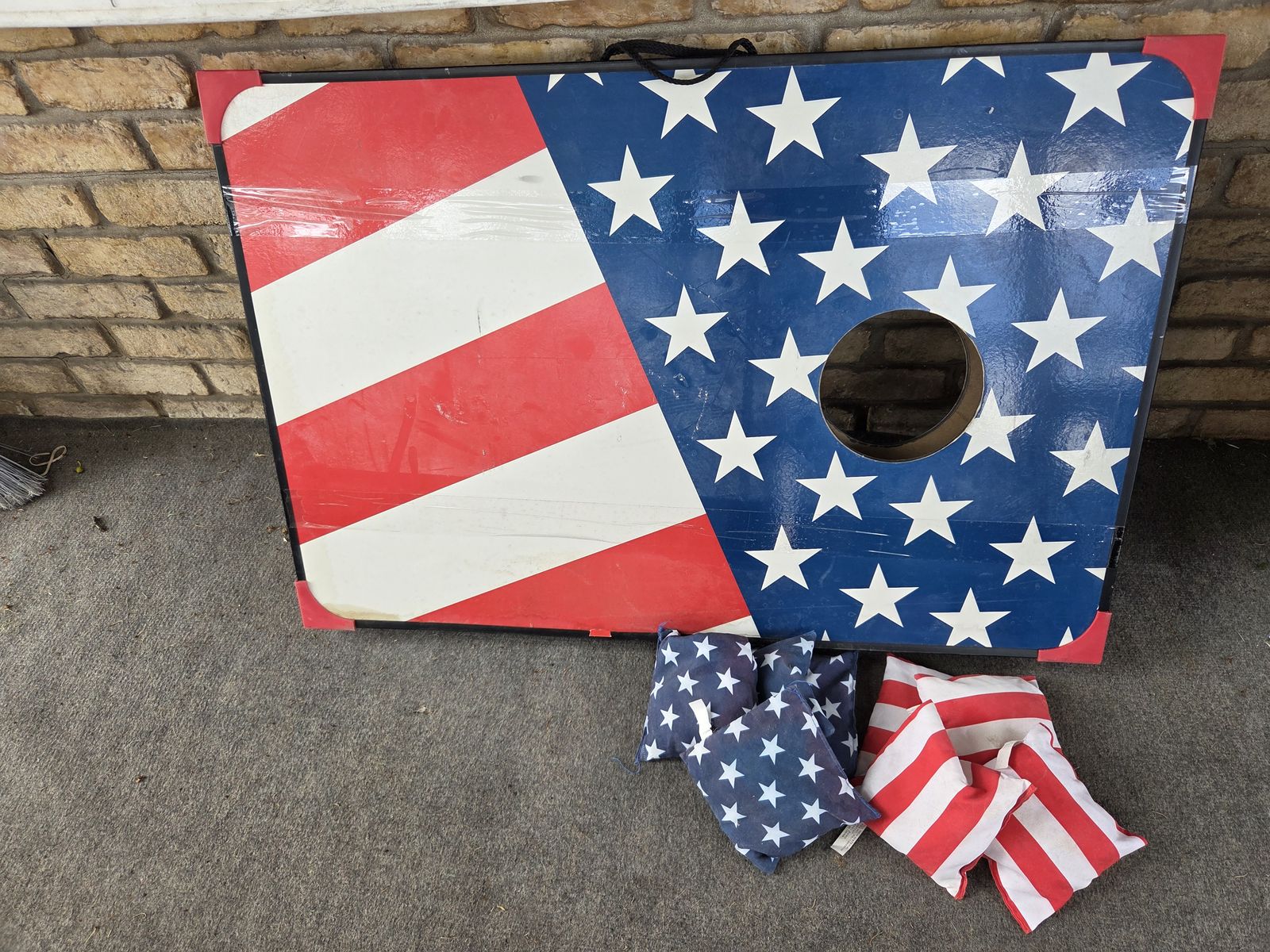 American flag patterned portable cornhole board set