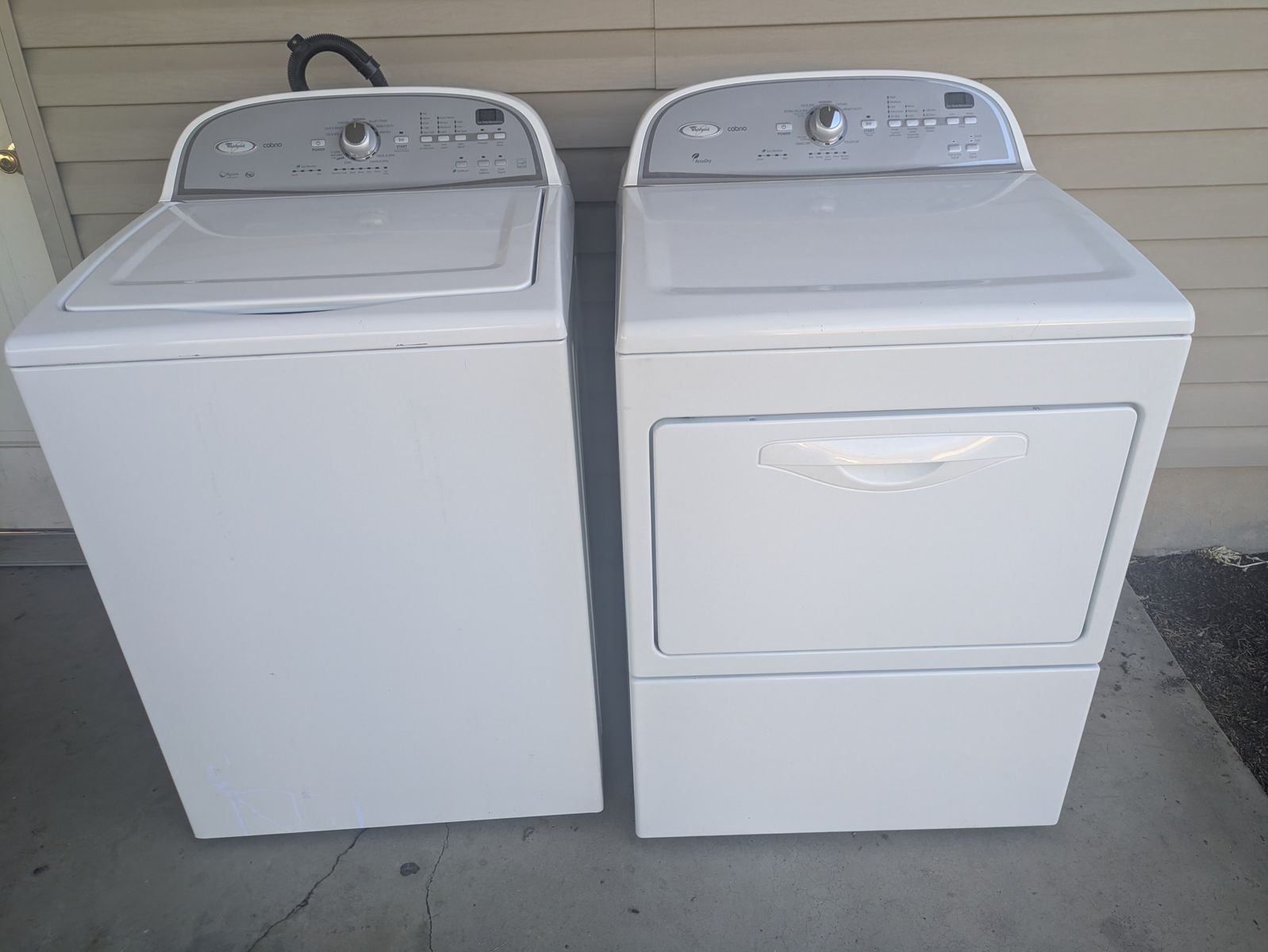 Whirlpool 3.6 cu. ft. top-load washer and 7.4 cu. ft. Dryer