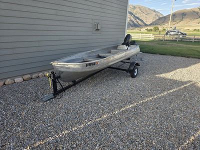 Aluminum Jon Boat with Mercury 9.8 HP Outboard Motor and Trailer