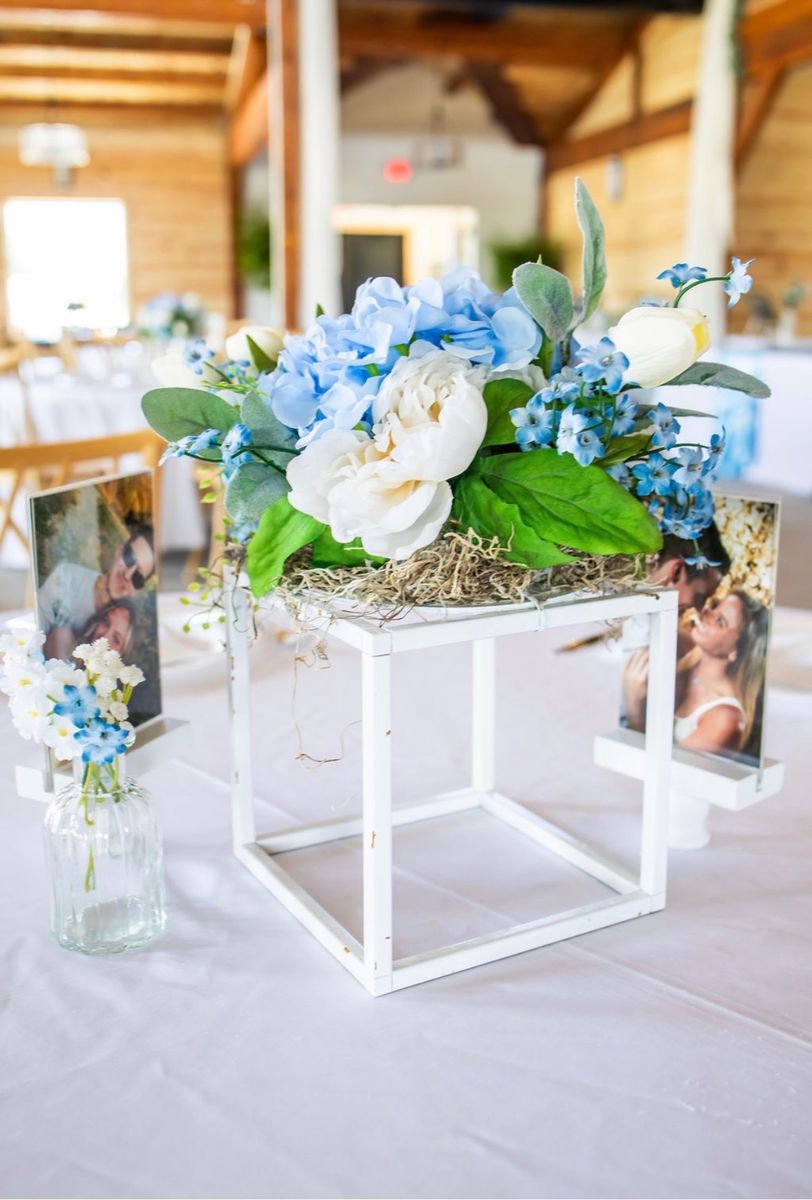 Blue and white wedding- centerpieces, photo stands, lanterns, wedding arch, ceiling drape, aisle runner, chair wraps