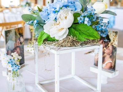 Blue and white wedding- centerpieces, photo stands, lanterns, wedding arch, ceiling drape, aisle runner, chair wraps