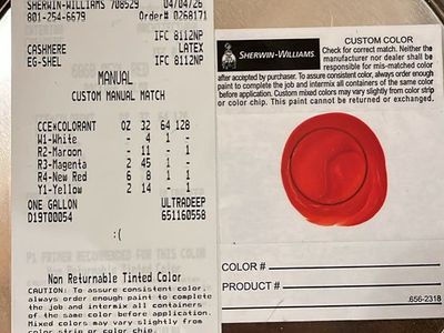 Two full cans of Sherwin Williams paint