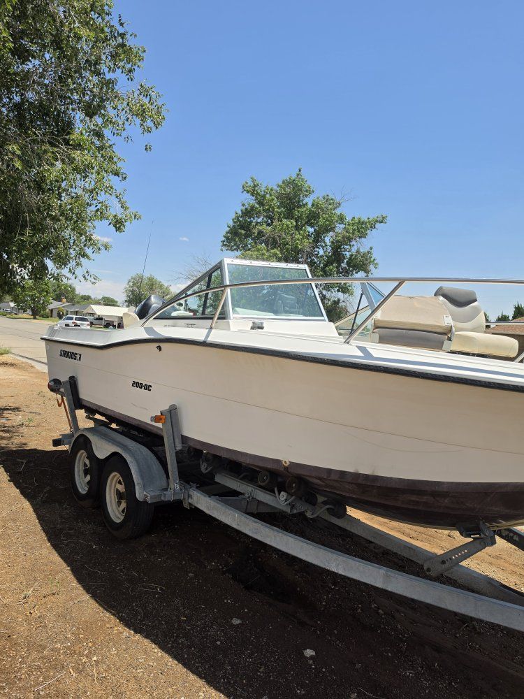 Stratos 200-DC Dual Console Boat with Mercury OptiMax & Suzuki Kicker on Trailer