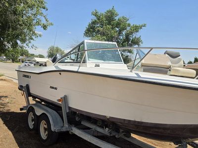 Stratos 200-DC Dual Console Boat with Mercury OptiMax & Suzuki Kicker on Trailer
