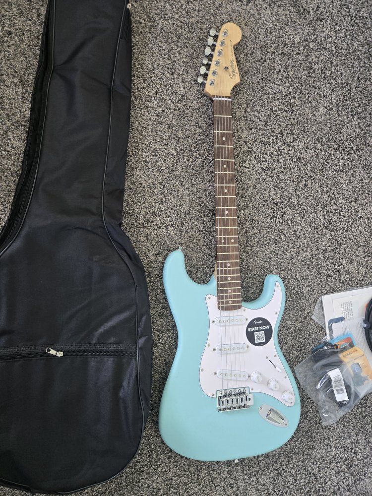 Squier by Fender Stratocaster Electric Guitar Bundle with Amp, Gig Bag, and Accessories