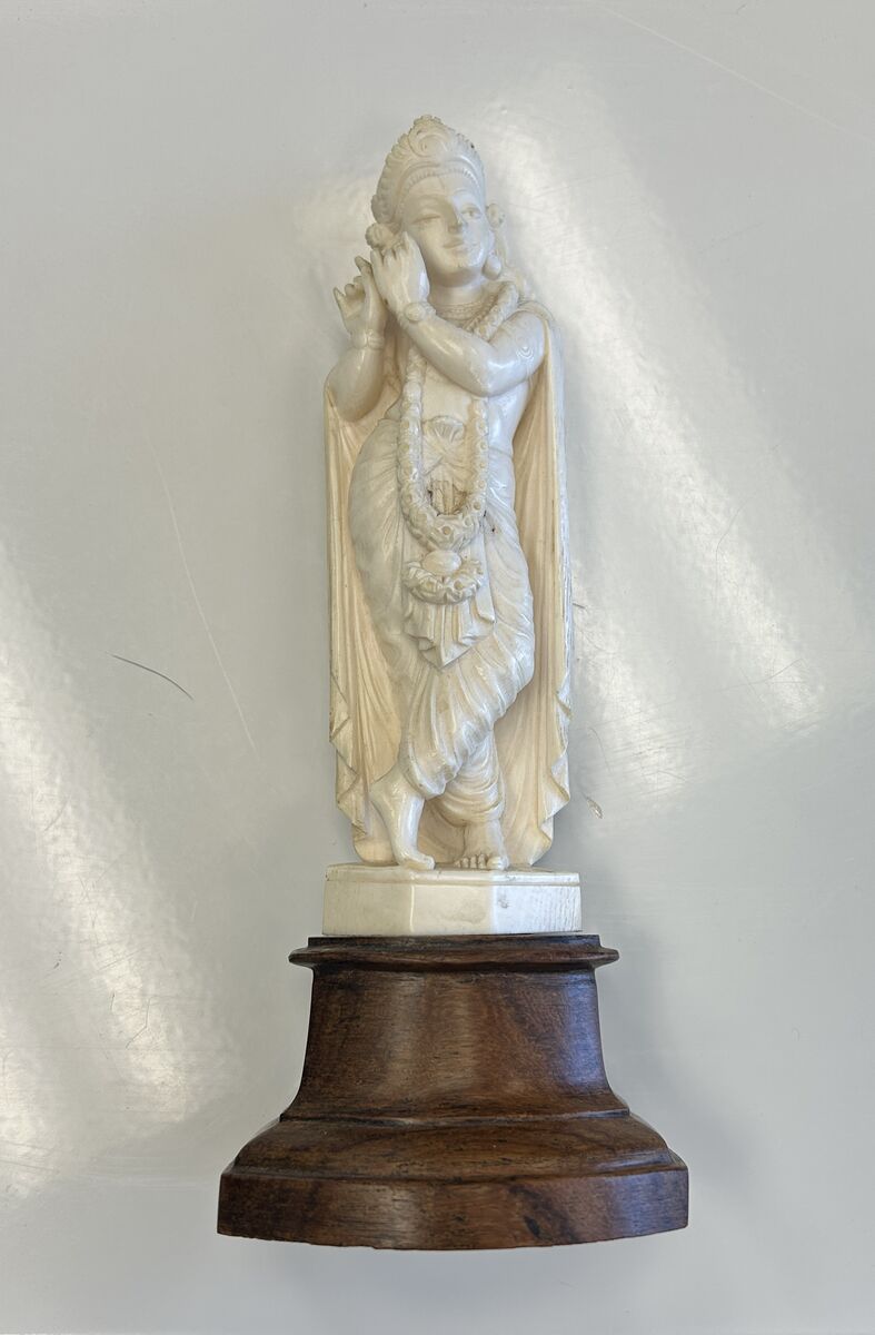 Hand‑Carved Wooden Deity Statue on Wooden Base – Detailed Decorative Figurine