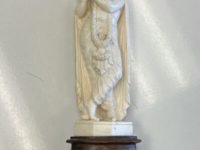 Hand‑Carved Wooden Deity Statue on Wooden Base – Detailed Decorative Figurine