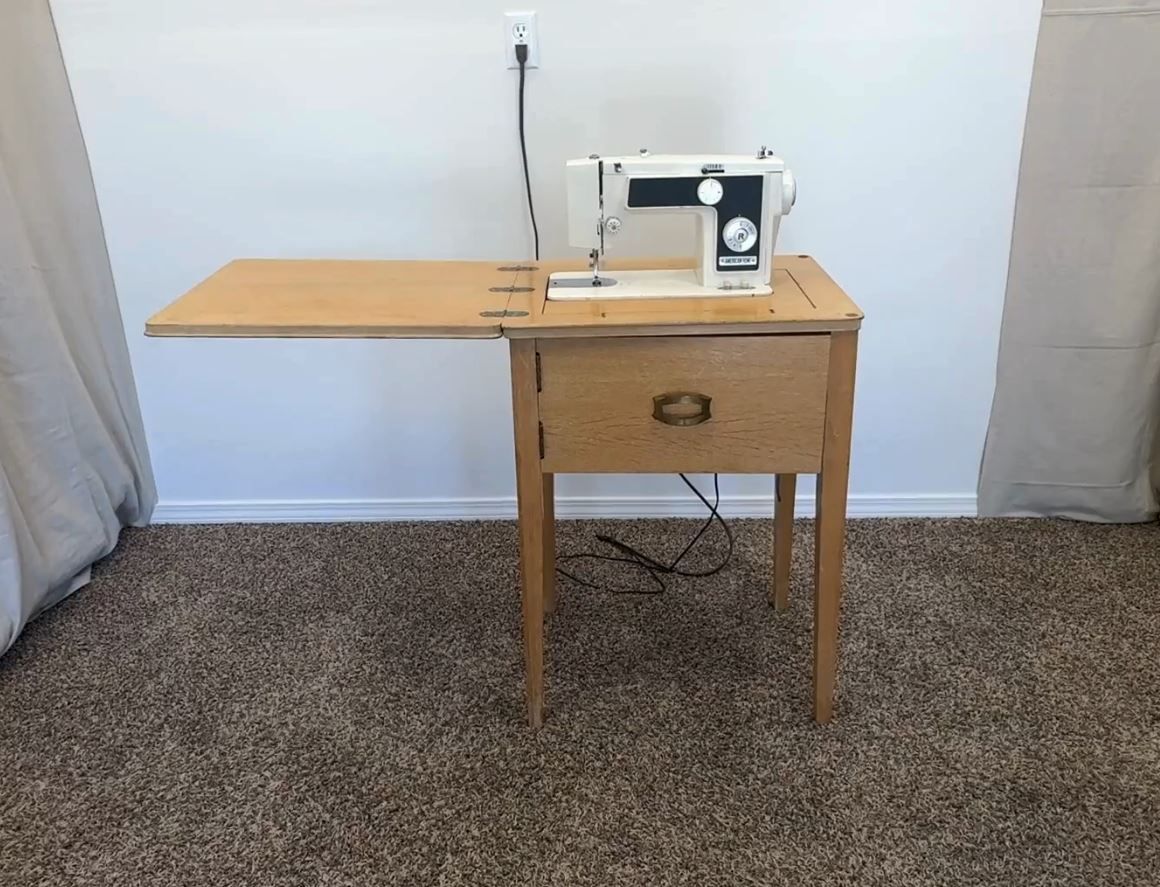 Delivery Avail- ANTIQUE American Home Sewing Machine and Hide Away Table