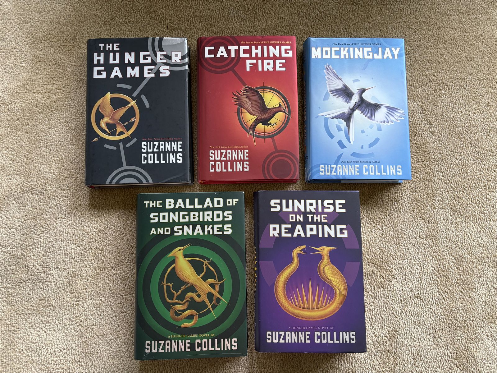 The Hunger Games Complete Series, by Suzanne Collins (hardcovers)