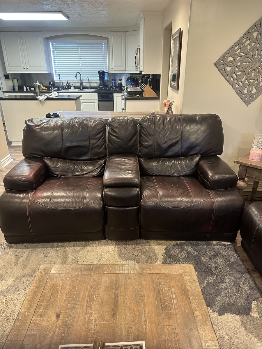 FREE!  Brown leather reclining love seat.