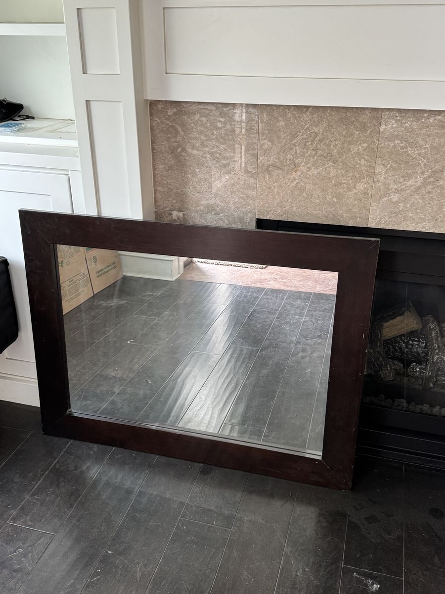 Dark wood framed mirror