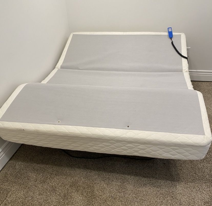 Queen Size Adjustable Bed Base.  $260.  OBO 