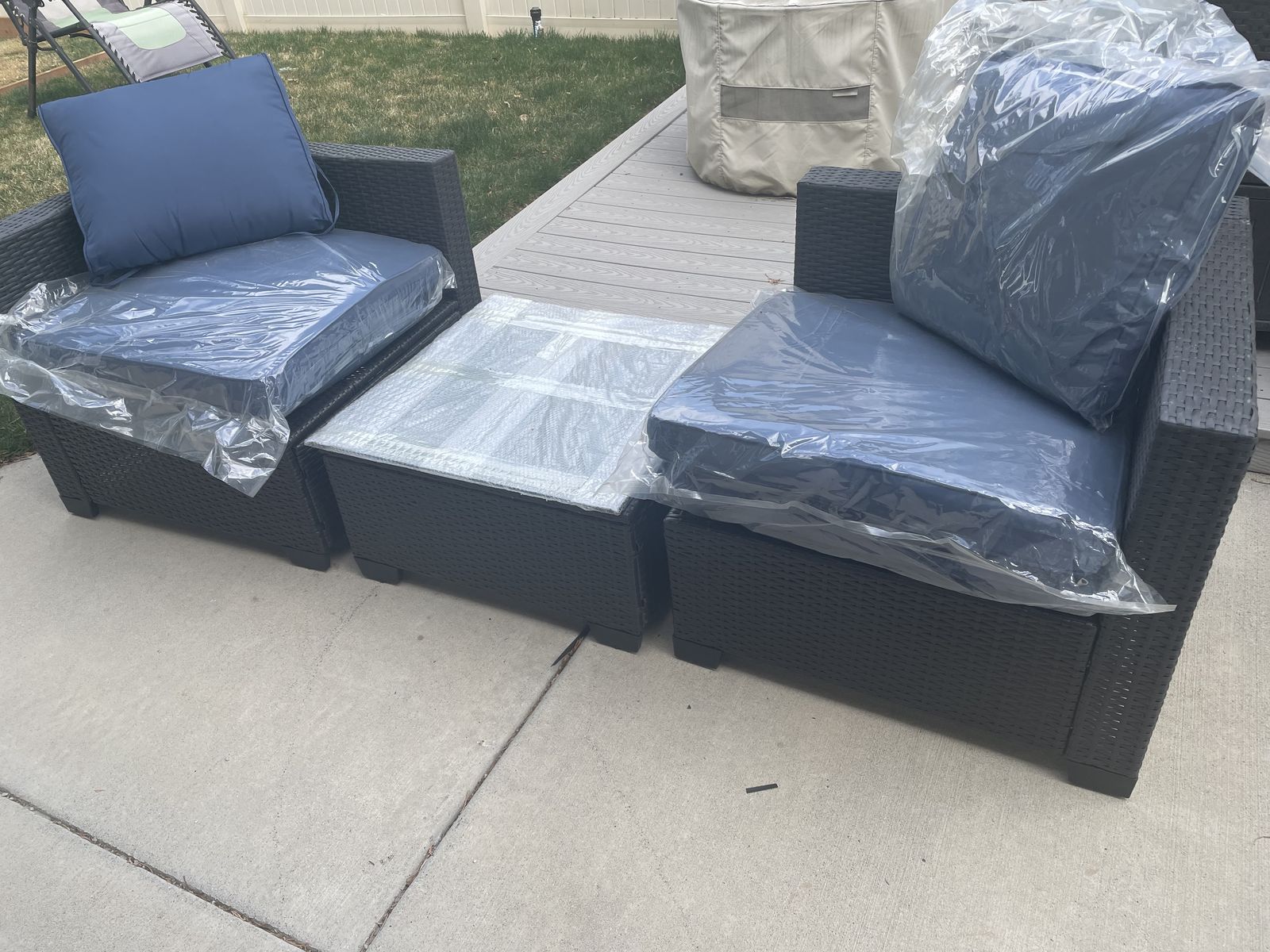 Brand new 3 piece wicker rattan set, 2 corner chairs and table, black w/dk blue cushions