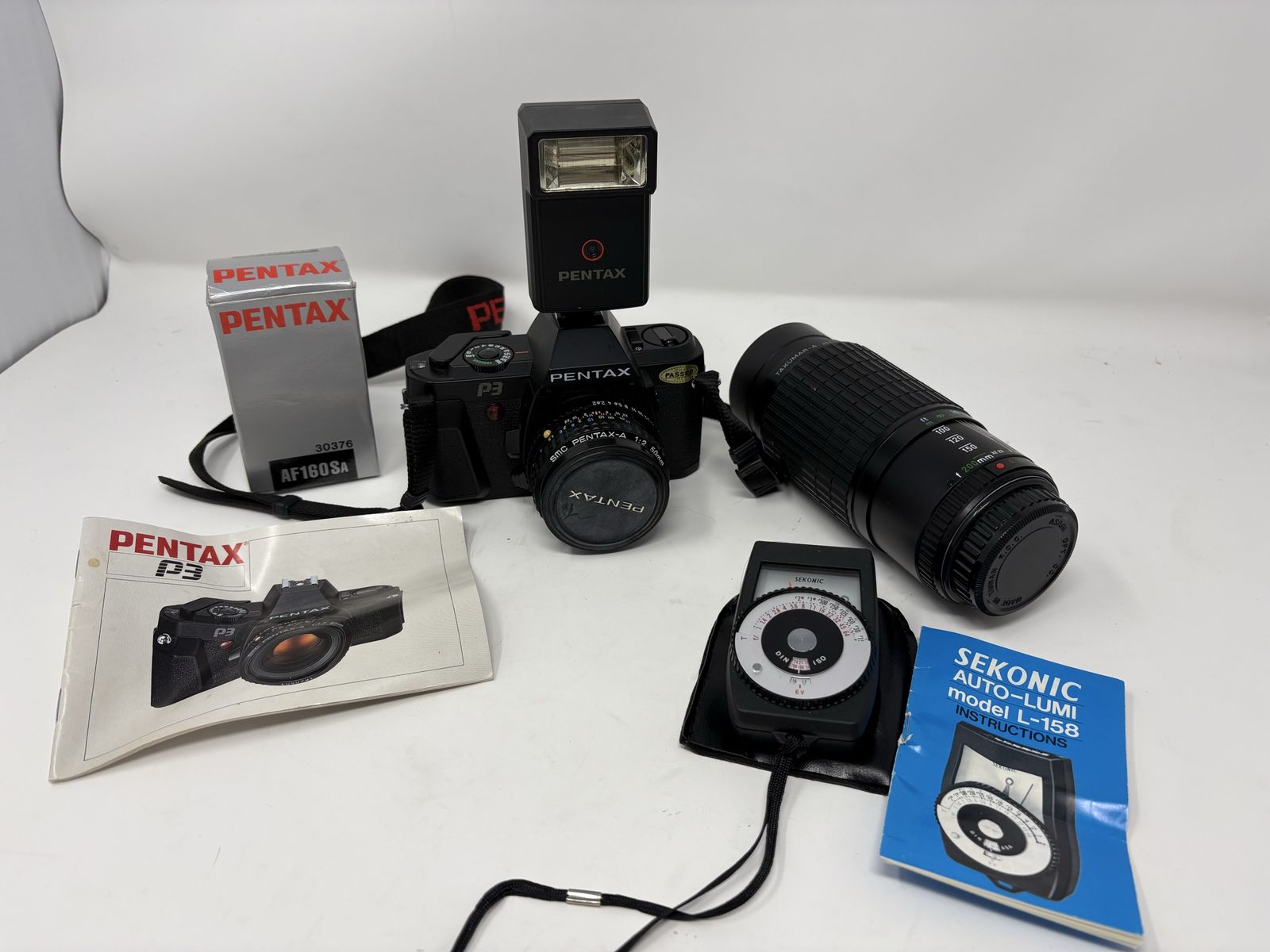 Pentax P3 35mm Film Camera Bundle w/ 50mm Lens, 80-200mm Zoom, Flash & Sekonic Meter