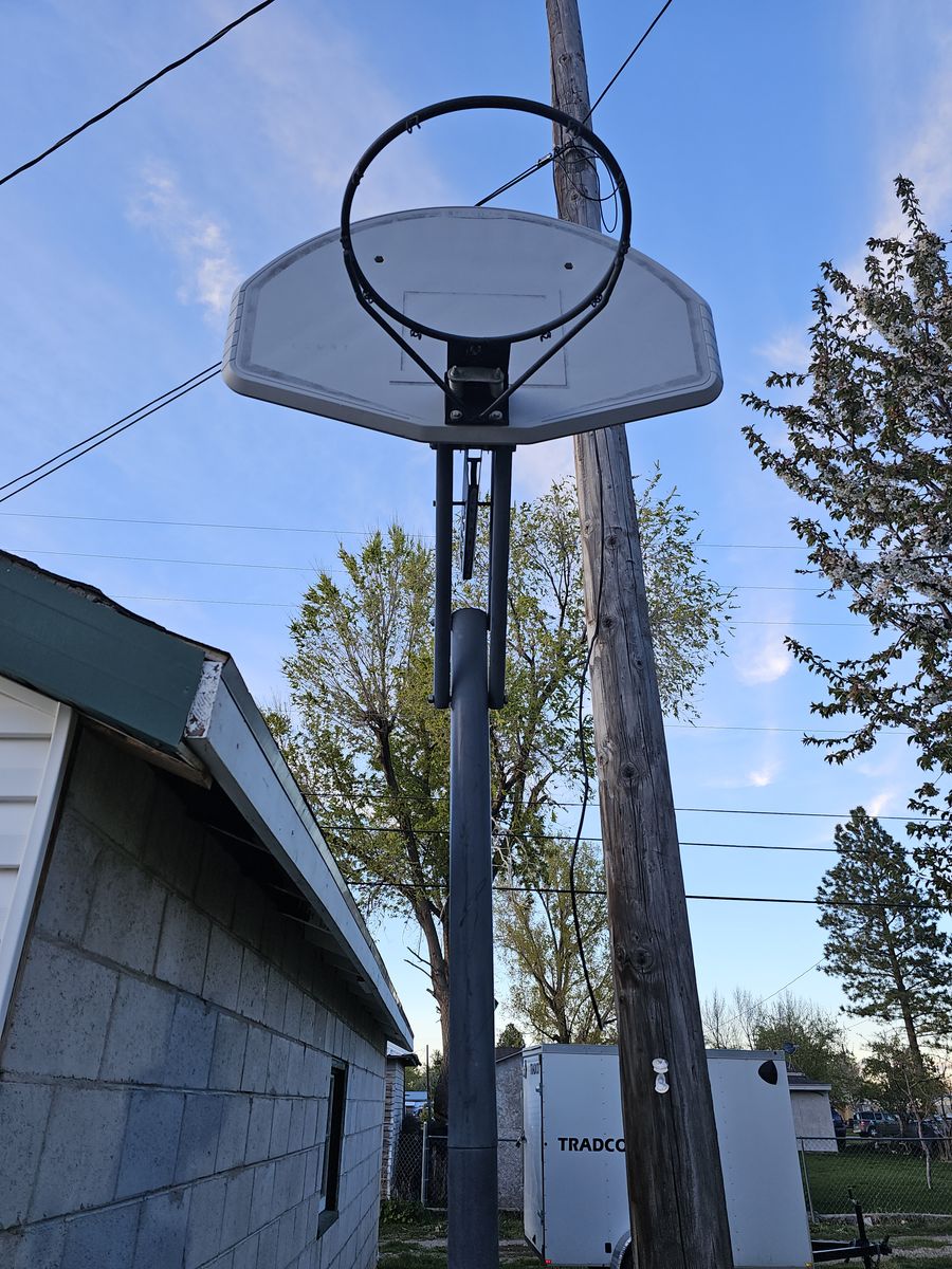 Portable basketball hoop adjustable height