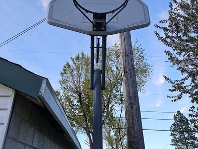 Portable basketball hoop adjustable height