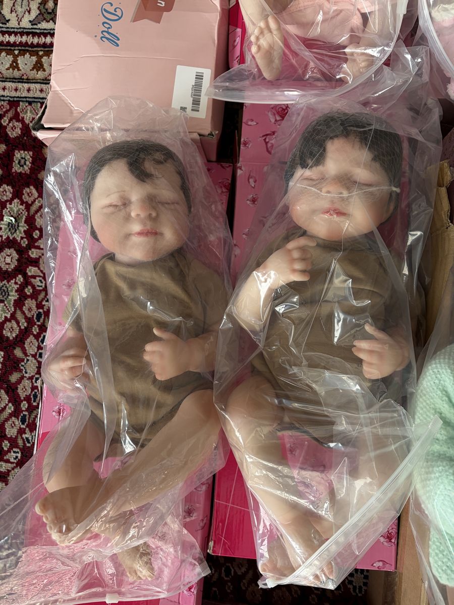 New in box,  lot of 14 life like baby dolls