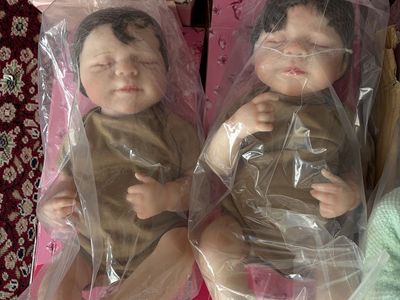 New in box, lot of 14 life like baby dolls