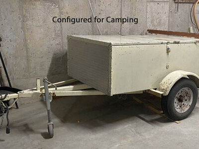 Unique car-camping and boat-carrying trailer