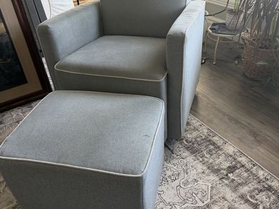 Gray swivel rocking chair